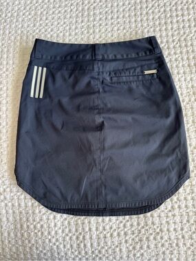 Adidas navy blue golf  Skort with Reflective Stripes front and back pockets